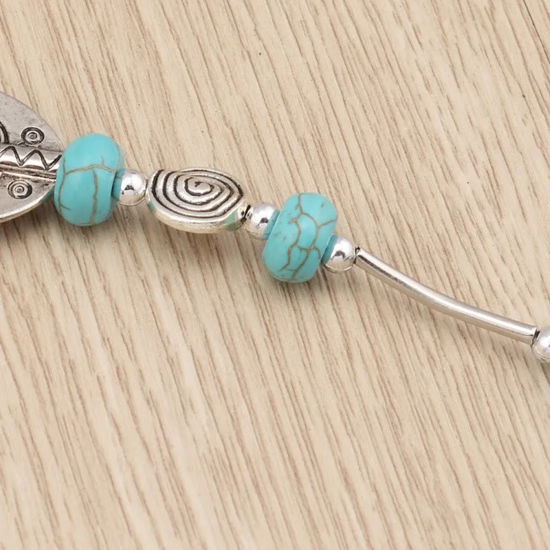 Carved Oblong and Turquoise Bead